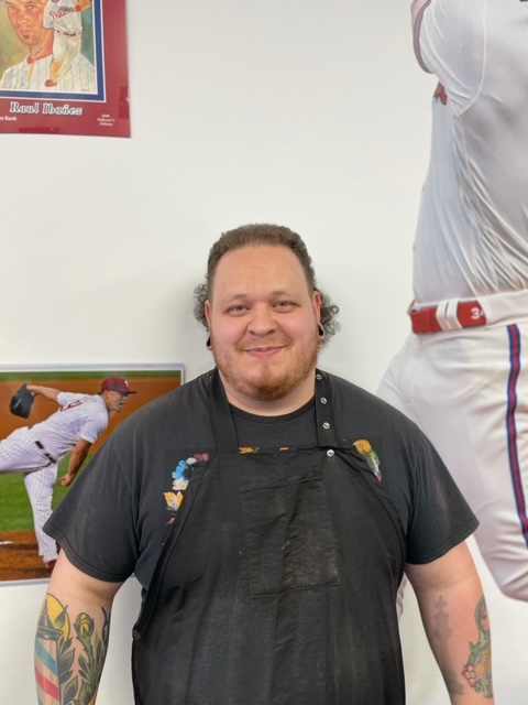 Barbershop worker with smiling face